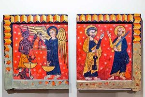 These two side panels from a church in the Ribes Valley are the work of this painter, characterised by the use of backgrounds of very bright colours, generally reds, yellows and greens, on which he draws the figures heavily outlined in black. The scene of the Archangel Michael weighing the souls, called the ‘psychostasis', is very similar to the one that appears on the panel from Soriguerola and is without doubt one of the most popular in Catalan mediaeval art. The archangel is holding the scales with the naked figure of a soul tipping to the side of salvation, while a devil with a hook is trying to make the scales tip over to his side. The other panel, also related to the iconography of salvation, shows the standing figure of Saint Peter, with the keys to Heaven, talking to the apostle Saint Paul. One of the salient features of this master is the capacity for narrative synthesis of the scenes drawn, far-removed from naïf or merely popular art.