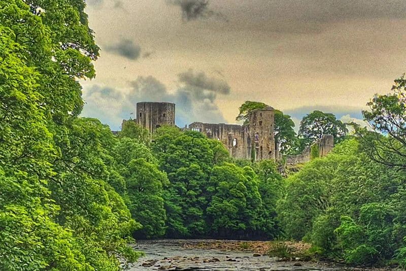 Barnard Castle, County Durham. View from the Silver Bridge over the River Tees - upstream of the Castle and town.